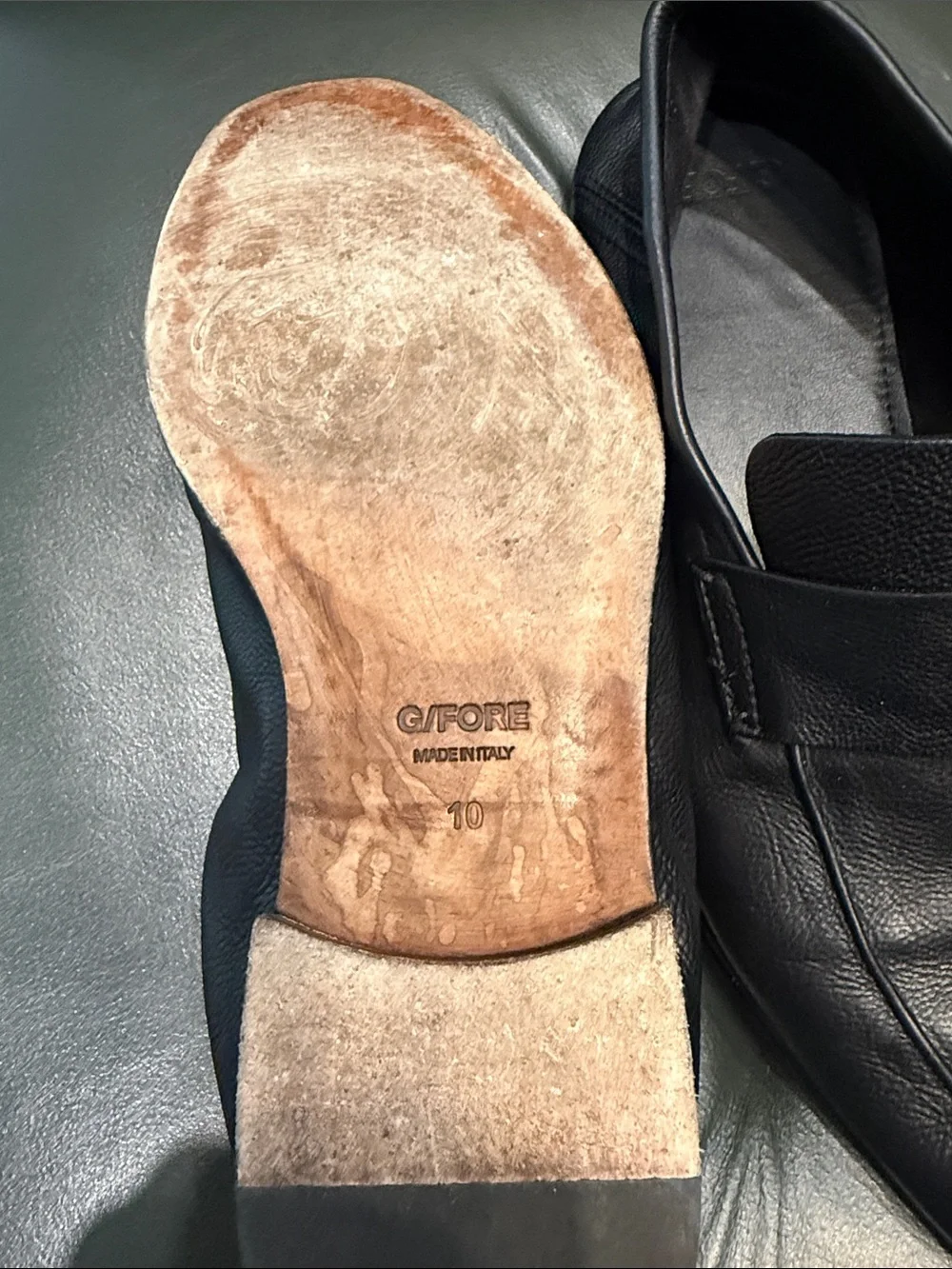 G/FORE Black Leather Slip-On Loafers with Gold Cross Accent